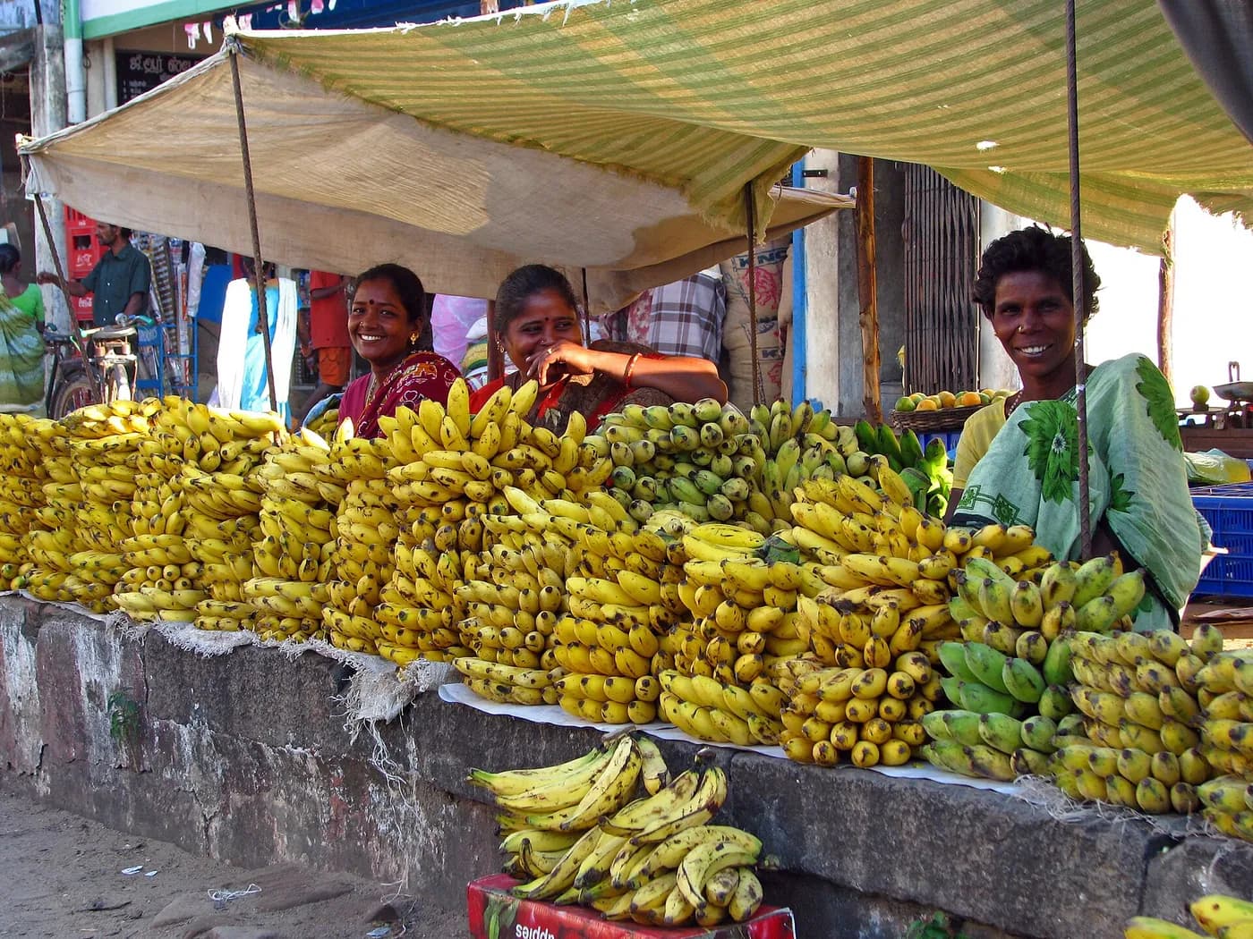 Vendors behind their stacked bunches of bananas