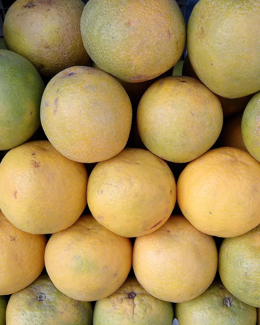 Sweet limes stacked in a neat pyramid